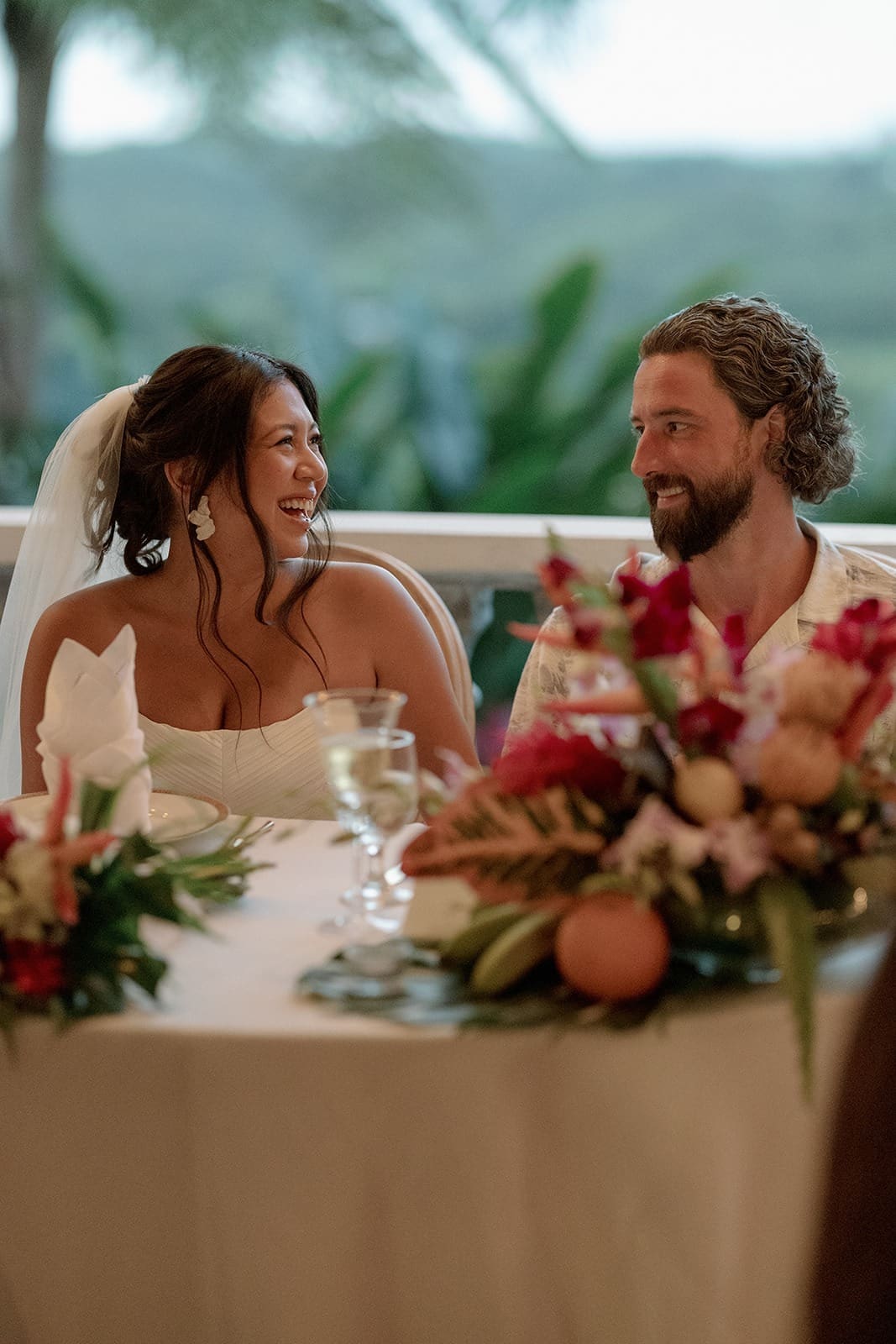 portrait of a bride and groom laughing during their reception at a rincon wedding venue
