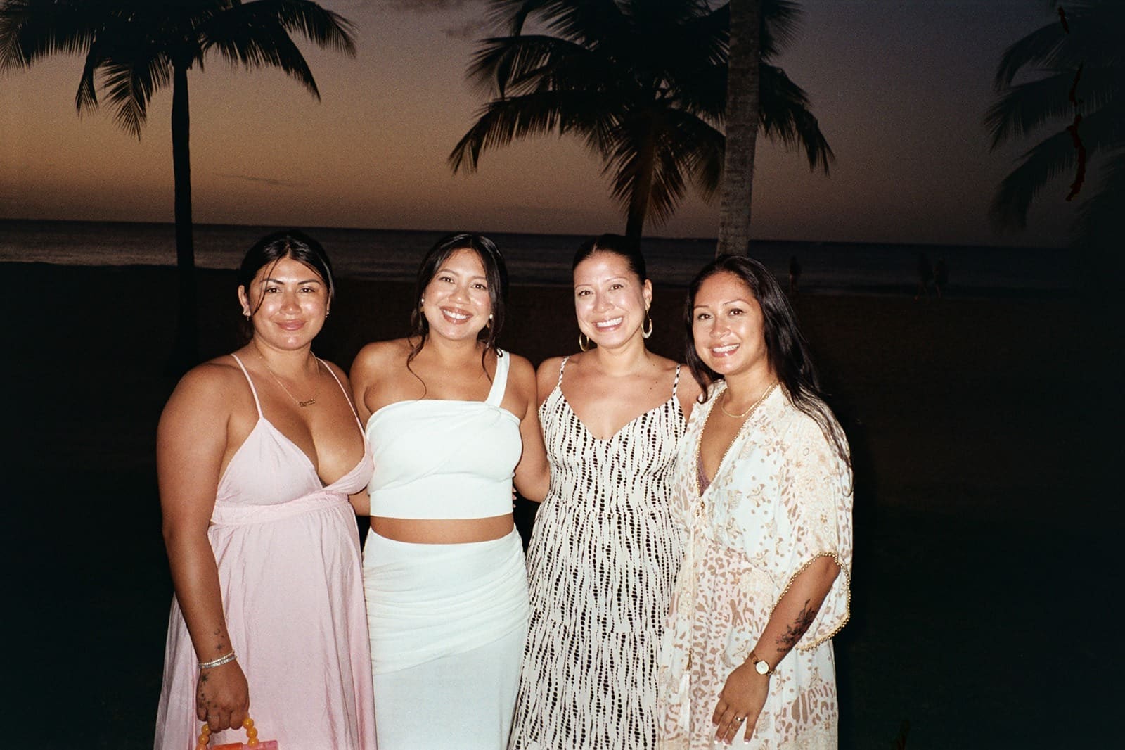 portrait of a bride and her bridesmaids during her wedding night at one of the best rincon wedding venues