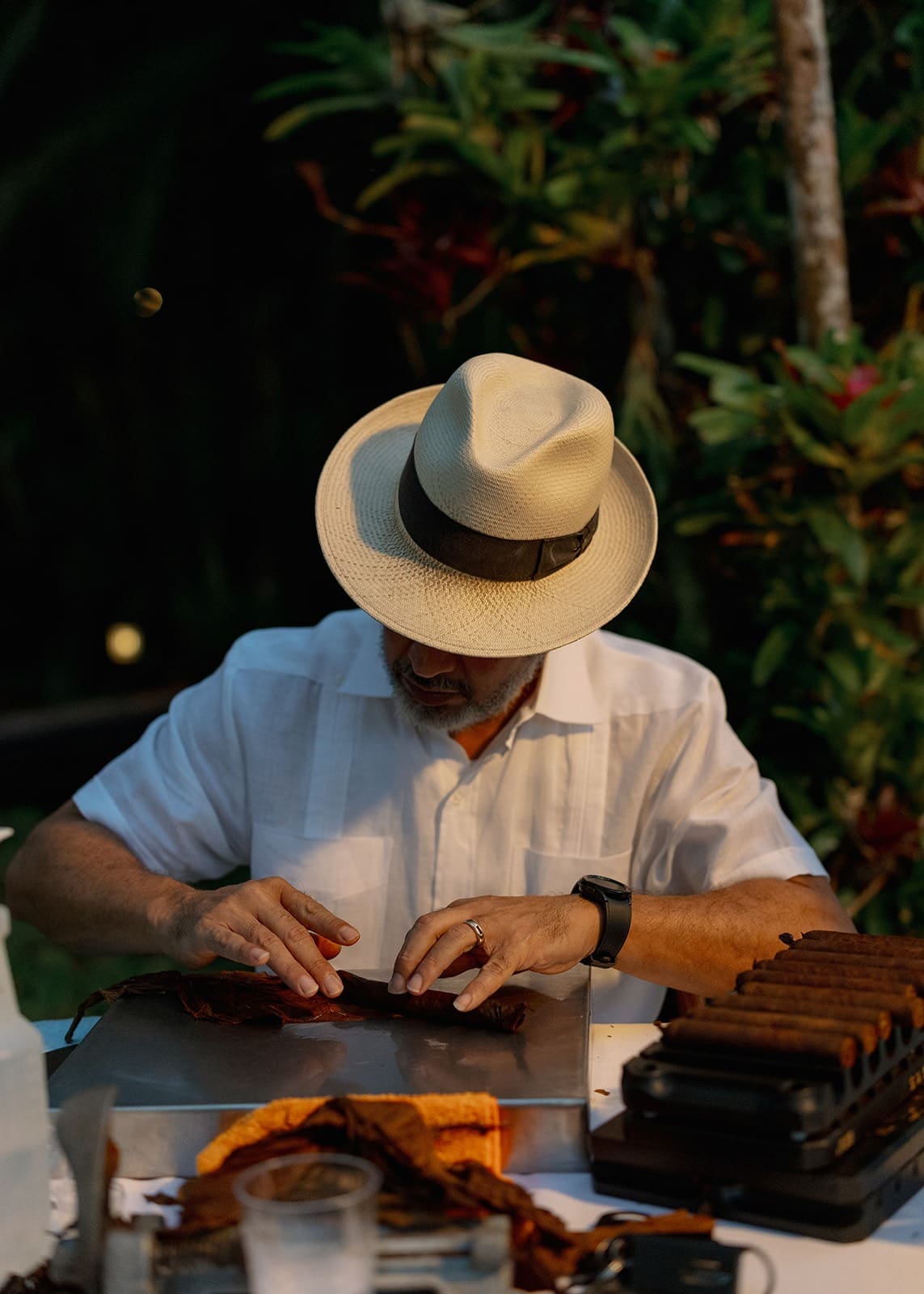 portrait of a man rolling cigars at a wedding held at one of the best wedding venues in rincon