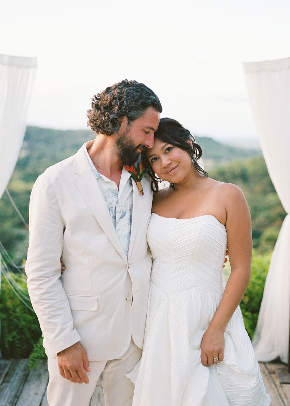 posed portait of a groom lovingly looking at his bride taken at one of the best rincon wedding venues