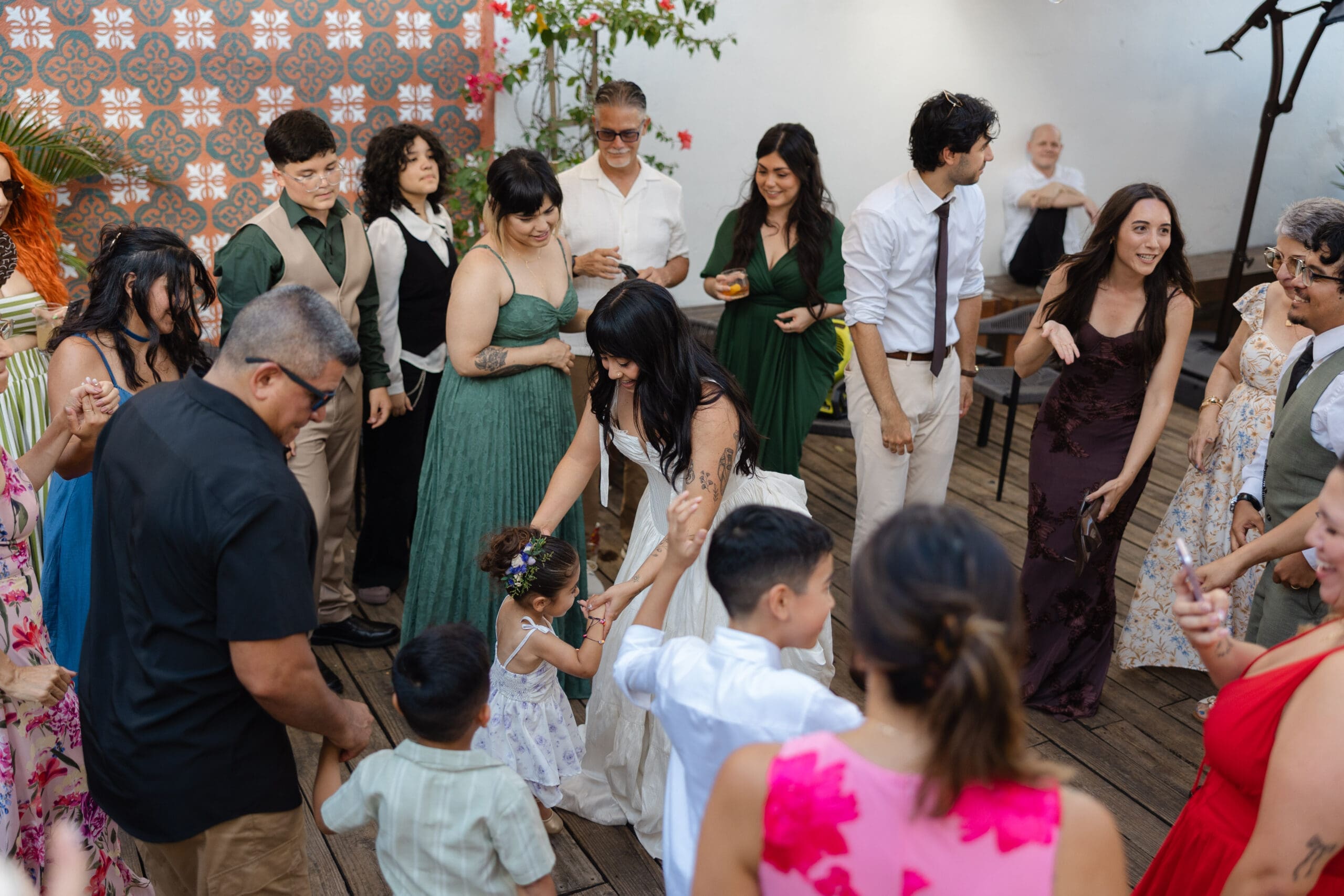 bride-celebrating-with-guests-outdoor-reception